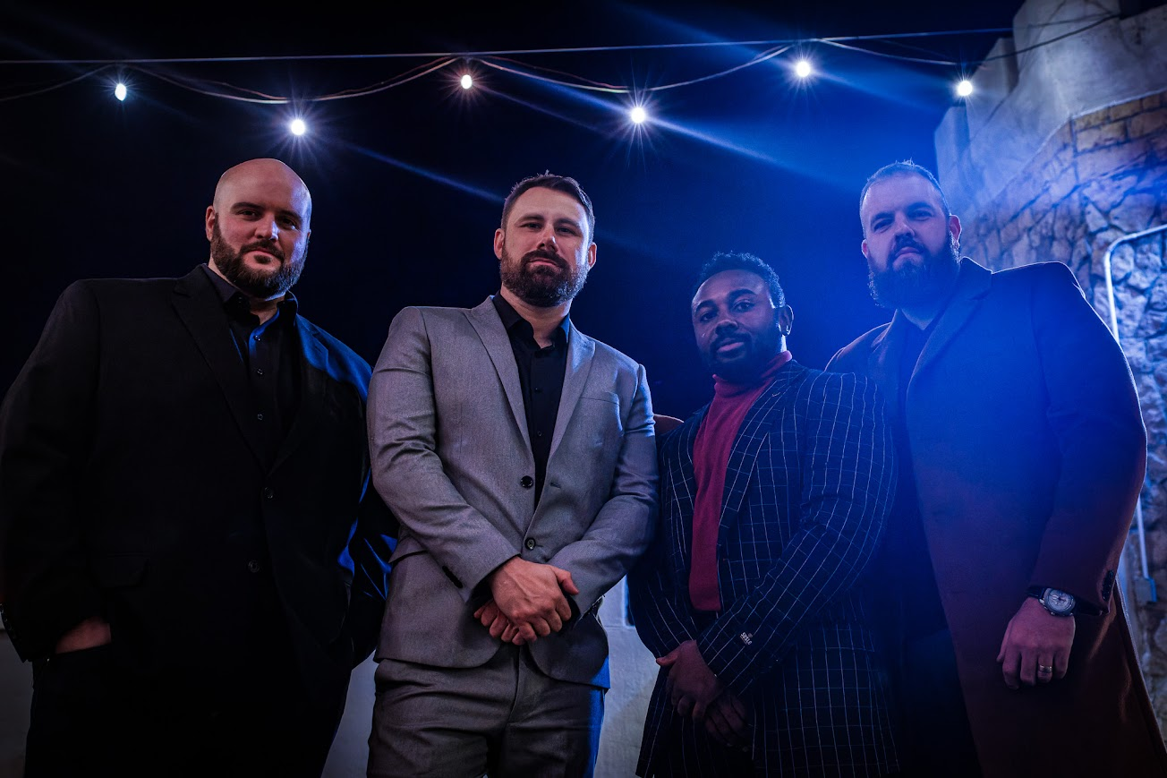 Group portrait under string lights